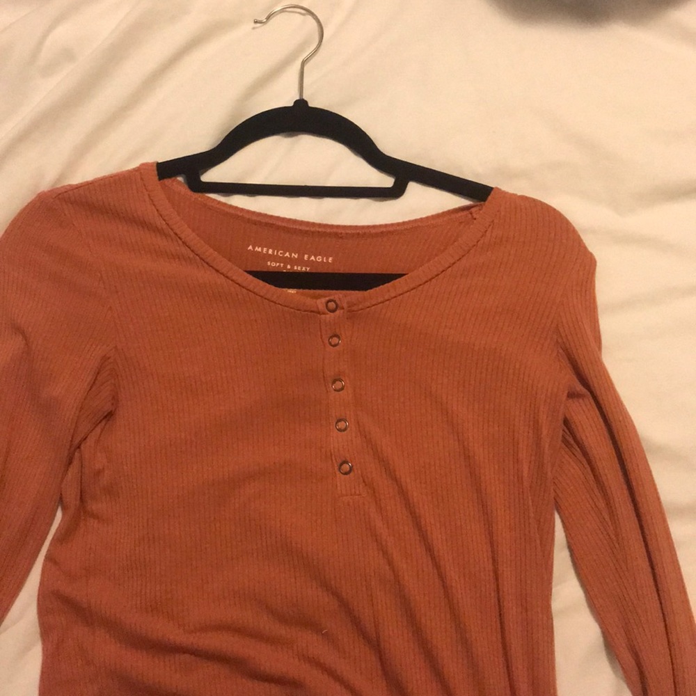 salmon color button down tight shirt